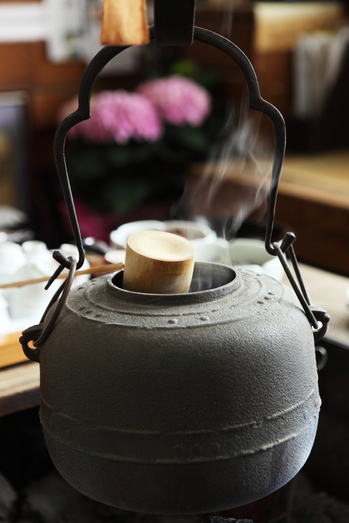 A cast-iron tetsubin kettle among teaware